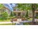 Captivating brick home featuring a covered front porch, beautiful landscaping, and a well-kept lawn at 2043 Mason Mill Rd, Decatur, GA 30033
