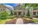 Elegant brick home with a manicured lawn and charming front porch at 2043 Mason Mill Rd, Decatur, GA 30033