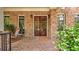 Inviting front porch featuring wood doors and vintage lanterns at 2043 Mason Mill Rd, Decatur, GA 30033