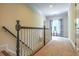 Bright upstairs hallway featuring carpet flooring, natural lighting and beautiful trim details at 2043 Mason Mill Rd, Decatur, GA 30033