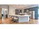 A modern kitchen showcases a large center island with seating, stainless steel appliances, and gray cabinetry at 2043 Mason Mill Rd, Decatur, GA 30033