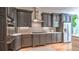 Beautiful kitchen features gray cabinets, modern stainless appliances, and light countertops with under-cabinet lighting at 2043 Mason Mill Rd, Decatur, GA 30033