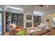 Living room features a fireplace with built-in shelving on either side, comfortable chairs, and a view into an adjacent room at 2043 Mason Mill Rd, Decatur, GA 30033