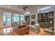 Stylish living room with hardwood floors, a fireplace, custom built-ins, and outdoor access at 2043 Mason Mill Rd, Decatur, GA 30033