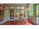 Inviting screened porch features rocking chairs, wooden floors, and a view of the outdoors at 2043 Mason Mill Rd, Decatur, GA 30033