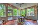 Charming screened porch with string lights and a view of the serene surroundings at 2043 Mason Mill Rd, Decatur, GA 30033