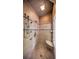 A tiled shower featuring a seat, shower head, handheld sprayer, and a clear glass door at 2043 Mason Mill Rd, Decatur, GA 30033