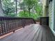Wood deck extends to home's exterior offering cozy space for outdoor relaxation at 2160 Towne Manor Nw Dr, Kennesaw, GA 30144