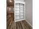 Built-in bookcase in living space with views to the entry at 2160 Towne Manor Nw Dr, Kennesaw, GA 30144