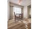 Bright dining area with wood-look floors and natural light at 2160 Towne Manor Nw Dr, Kennesaw, GA 30144