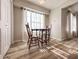 Bright dining area with wood-look floors and natural light at 2160 Towne Manor Nw Dr, Kennesaw, GA 30144