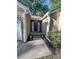View of the front entryway with a bright blue door, flanked by greenery at 2160 Towne Manor Nw Dr, Kennesaw, GA 30144