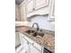 Kitchen features stainless steel sink and stylish granite countertops at 2160 Towne Manor Nw Dr, Kennesaw, GA 30144