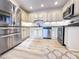 Beautiful kitchen features stainless steel appliances, granite countertops, and white cabinets at 2160 Towne Manor Nw Dr, Kennesaw, GA 30144