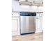 Stainless steel dishwasher surrounded by granite countertops and white cabinets at 2160 Towne Manor Nw Dr, Kennesaw, GA 30144