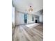 Bright living room with wood floors, natural light, and access to the outside at 2160 Towne Manor Nw Dr, Kennesaw, GA 30144