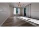 Bright living room with wood floors, natural light, and access to the outside at 2160 Towne Manor Nw Dr, Kennesaw, GA 30144