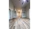 Spacious living area with built-in shelving and luxury vinyl plank flooring at 2160 Towne Manor Nw Dr, Kennesaw, GA 30144