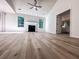 Bright living room with fireplace, modern flooring, and views into the primary bedroom at 2160 Towne Manor Nw Dr, Kennesaw, GA 30144