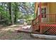Exterior view of home's backyard deck with a small, detached storage shed on the property at 4120 Buckley Woods Dr, Norcross, GA 30093