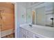 Bathroom featuring a tub, shower, toilet, and a vanity with sink and large mirror at 4120 Buckley Woods Dr, Norcross, GA 30093