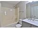Bathroom with a shower and tub combo, vanity, sink, toilet and large mirror at 4120 Buckley Woods Dr, Norcross, GA 30093