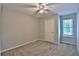Neutral bedroom with carpet, a ceiling fan, one window and a closet door at 4120 Buckley Woods Dr, Norcross, GA 30093