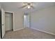 Neutral bedroom featuring a ceiling fan, carpet floors, and a closet with an open door at 4120 Buckley Woods Dr, Norcross, GA 30093