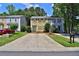 Charming two-story townhouse with a spacious driveway and well-maintained front lawn and landscaped yard at 4120 Buckley Woods Dr, Norcross, GA 30093