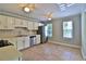 Bright eat-in kitchen with stainless steel appliances, white cabinets, and natural light at 4120 Buckley Woods Dr, Norcross, GA 30093