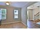 Bright kitchen featuring ceramic tile floors, with views of the entryway and staircase at 4120 Buckley Woods Dr, Norcross, GA 30093