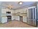 Bright eat-in kitchen featuring stainless steel appliances, ample counter space, and ceramic tile flooring at 4120 Buckley Woods Dr, Norcross, GA 30093