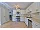 Traditional kitchen featuring white cabinets, stainless steel appliances, and light countertops at 4120 Buckley Woods Dr, Norcross, GA 30093