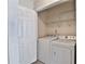 Laundry room featuring a white washer and dryer, a closet, and white shelving at 4120 Buckley Woods Dr, Norcross, GA 30093