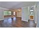 Sunlit living room featuring hardwood floors, sliding glass doors, and nearby bathroom at 4120 Buckley Woods Dr, Norcross, GA 30093