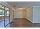 Spacious living room featuring hardwood floors, sliding glass doors, and ceiling fan at 4120 Buckley Woods Dr, Norcross, GA 30093