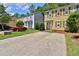 Street view of home with driveway, landscaping, and other nearby properties at 4120 Buckley Woods Dr, Norcross, GA 30093