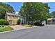 Exterior view of home and the neighborhood with manicured lawns and paved street at 4120 Buckley Woods Dr, Norcross, GA 30093