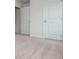 A bright bedroom with a plush carpet and a closet at 174 Bloomfield Cir, Canton, GA 30114