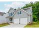 Charming two-story home with a well-manicured lawn and an attached two car garage at 174 Bloomfield Cir, Canton, GA 30114