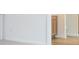 Hallway featuring plush carpet and a view of wood cabinets at 174 Bloomfield Cir, Canton, GA 30114