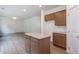 Open kitchen area with island and view of living space at 174 Bloomfield Cir, Canton, GA 30114