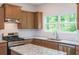 Stylish kitchen showcasing granite counters and stainless steel appliances at 174 Bloomfield Cir, Canton, GA 30114