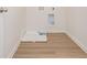 Laundry room with hardwood floors and hookups for a washer and dryer at 174 Bloomfield Cir, Canton, GA 30114
