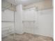 Empty walk-in closet featuring metal shelving and neutral walls at 3694 Arrowhead Pl, Douglasville, GA 30135