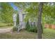 Split-level home with a two-car garage and a walkway to the front door at 3694 Arrowhead Pl, Douglasville, GA 30135
