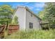 View of the side of the house showing the backyard and deck at 3694 Arrowhead Pl, Douglasville, GA 30135
