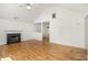 Living room with hardwood floors, fireplace, and ceiling fan at 3694 Arrowhead Pl, Douglasville, GA 30135