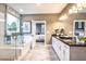Bright bathroom featuring a soaking tub, glass shower, and access to the bedroom at 5121 Hillside Haven Drive, Powder Springs, GA 30127