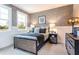 Stylish bedroom featuring starry wallpaper, two windows, and modern furnishings at 5121 Hillside Haven Drive, Powder Springs, GA 30127